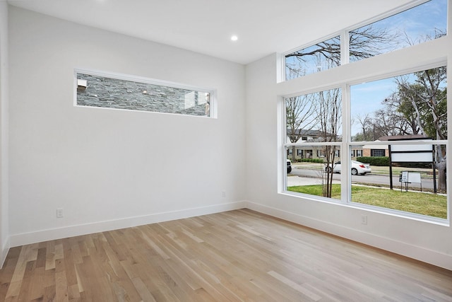 unfurnished room featuring light hardwood / wood-style floors