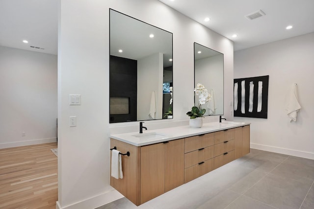 bathroom with tile patterned flooring and vanity