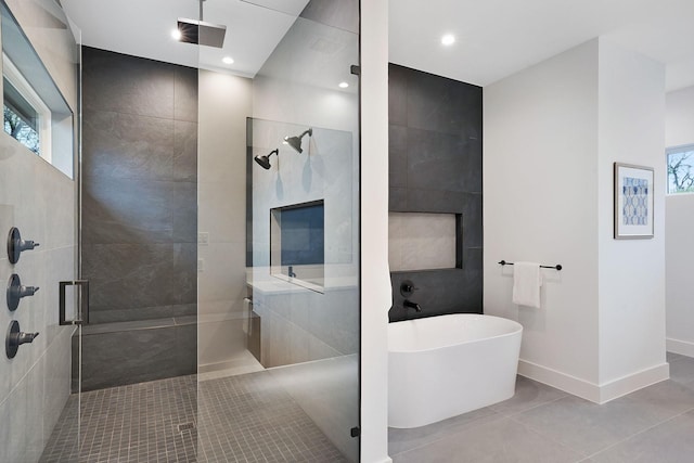 bathroom featuring a wealth of natural light, tile patterned flooring, and shower with separate bathtub