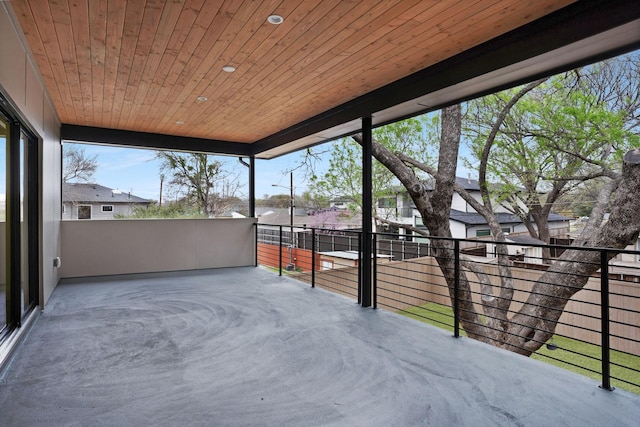 unfurnished sunroom with wood ceiling