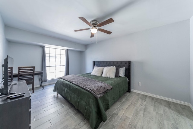 bedroom featuring ceiling fan and light hardwood / wood-style flooring