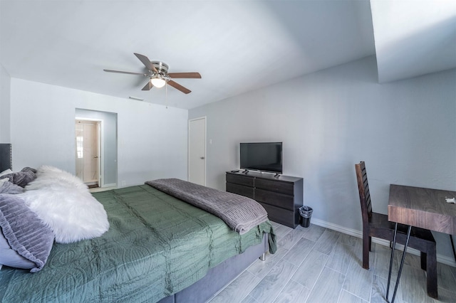 bedroom with ceiling fan and light hardwood / wood-style floors