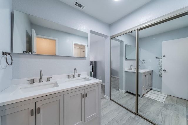 bathroom featuring vanity and hardwood / wood-style floors