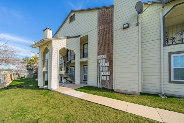 view of home's exterior with a yard