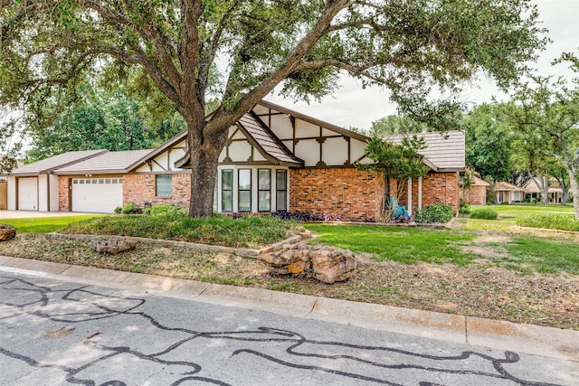 view of front of house featuring a garage and a front yard