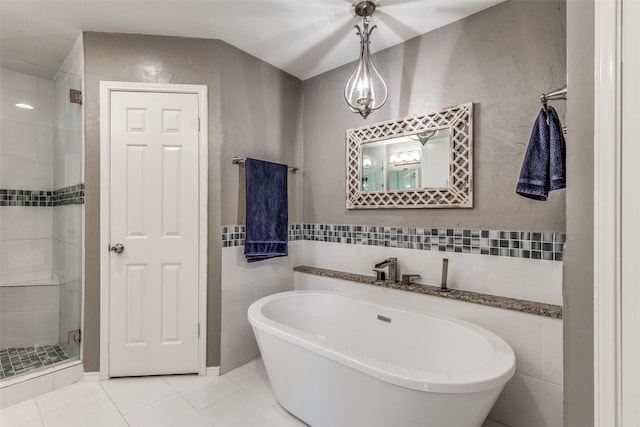 bathroom with tile patterned flooring and plus walk in shower