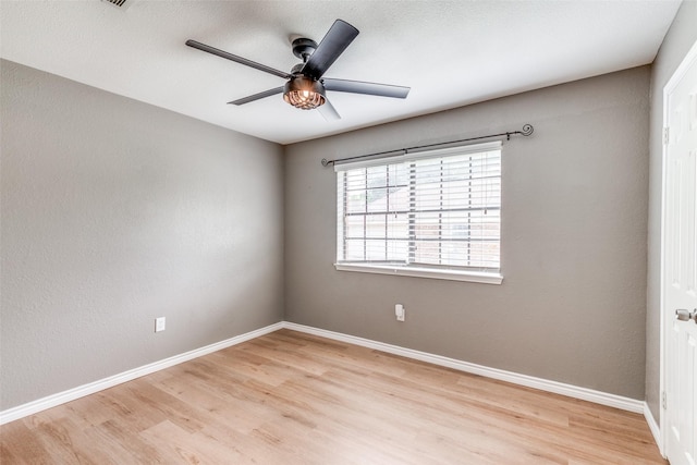 empty room with light hardwood / wood-style floors