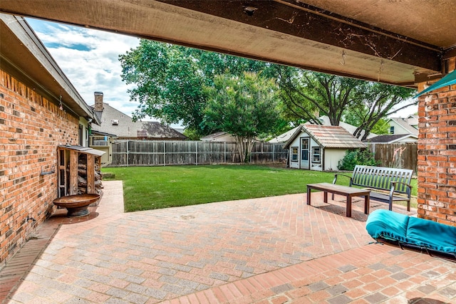 view of patio / terrace with an outdoor structure