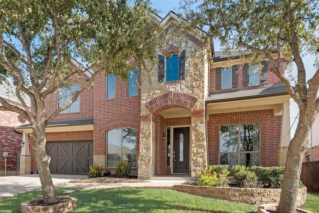 view of front facade with a front yard and a garage