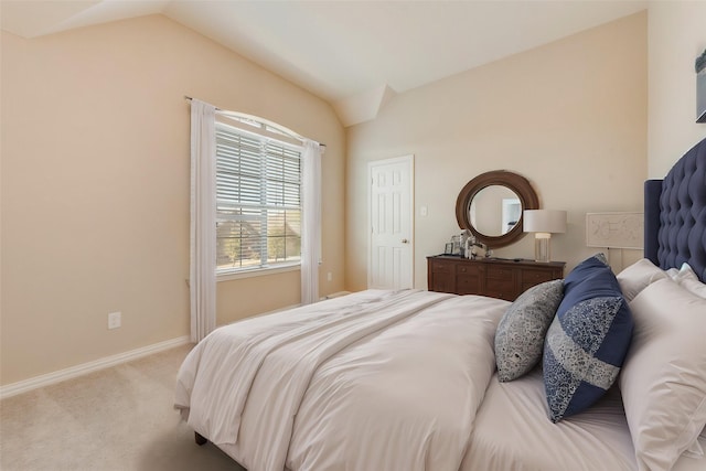 bedroom featuring carpet flooring and lofted ceiling