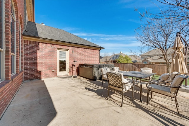 view of patio / terrace with a hot tub