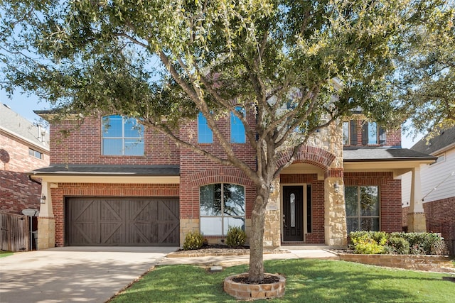 view of front of home featuring a front yard and a garage