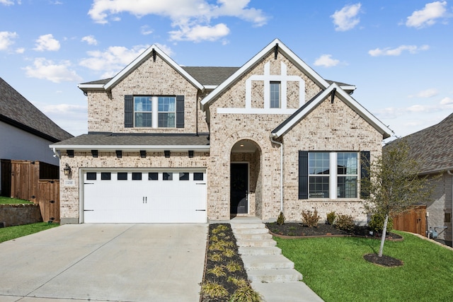 view of front of home featuring a garage and a front lawn