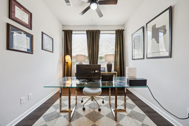 home office featuring ceiling fan and dark hardwood / wood-style flooring