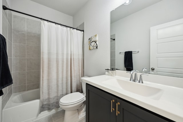 full bathroom with tile patterned floors, vanity, toilet, and shower / tub combo