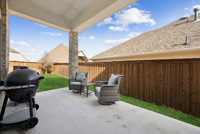 view of patio featuring a grill