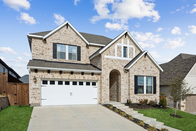 view of front of house featuring a garage and a front yard