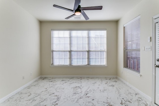 spare room featuring ceiling fan