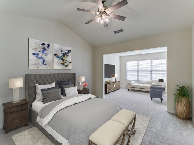 carpeted bedroom with ceiling fan and lofted ceiling