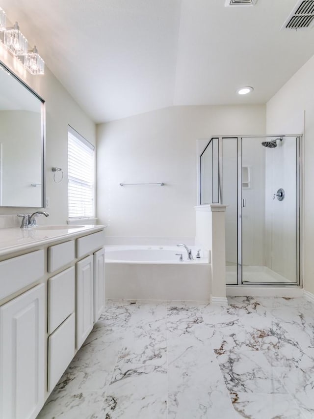 bathroom featuring vanity, a notable chandelier, and plus walk in shower