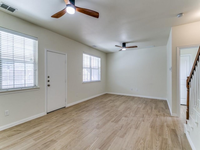 interior space featuring ceiling fan, a wealth of natural light, and light hardwood / wood-style floors