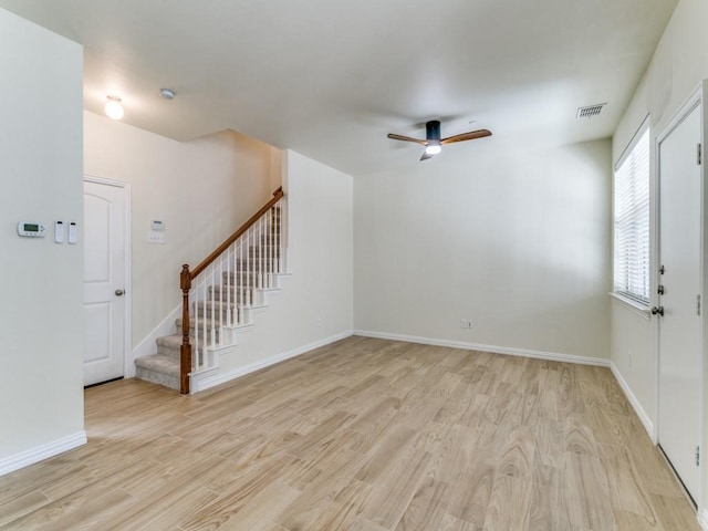 unfurnished living room with ceiling fan and light hardwood / wood-style floors