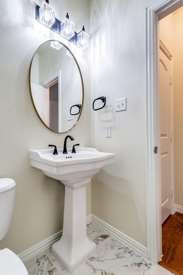 bathroom with toilet and sink