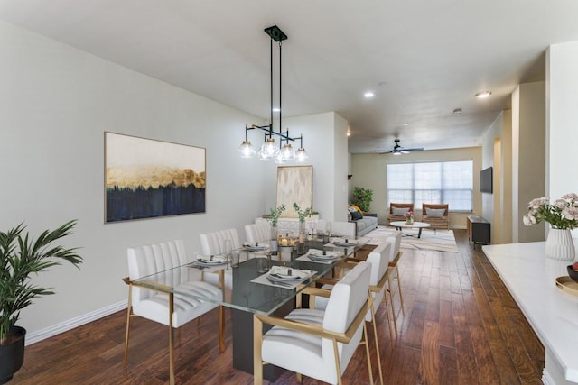 dining space featuring ceiling fan and dark wood-type flooring