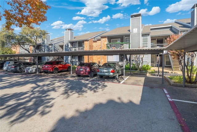 view of parking / parking lot with a carport