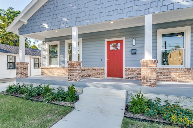 property entrance featuring covered porch