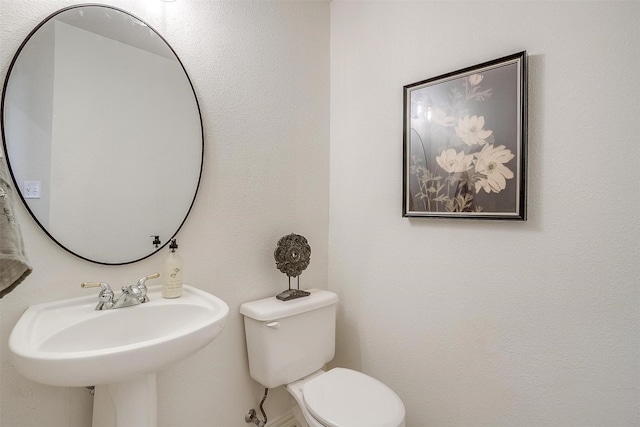 bathroom with a sink and toilet