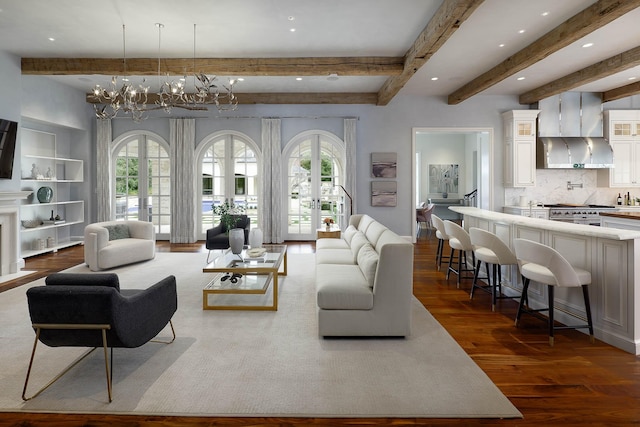 living room with beam ceiling, a healthy amount of sunlight, french doors, and dark wood-type flooring