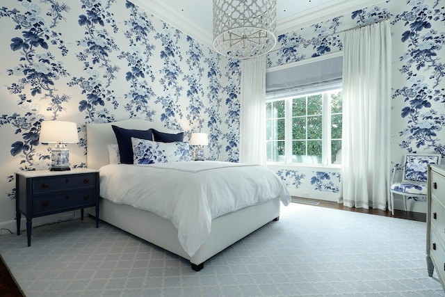 bedroom with a chandelier and ornamental molding