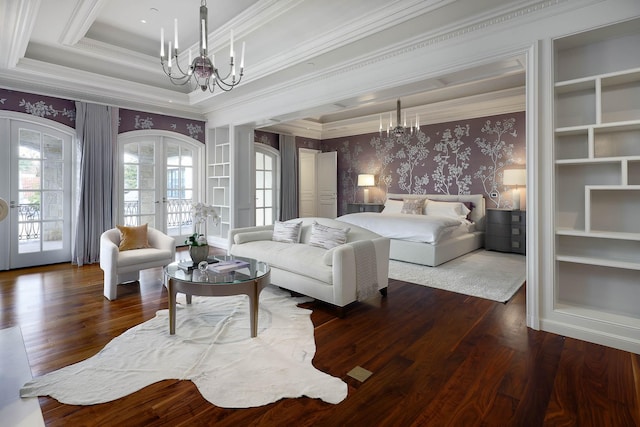 bedroom featuring access to exterior, dark hardwood / wood-style floors, crown molding, french doors, and a chandelier