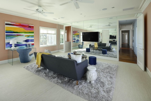 living room featuring ceiling fan and crown molding