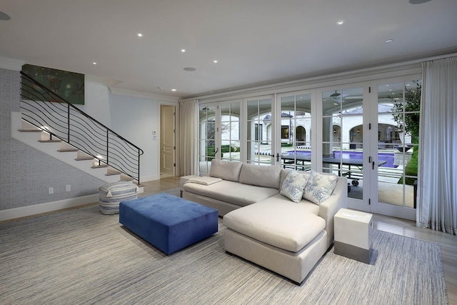 living room featuring french doors and crown molding