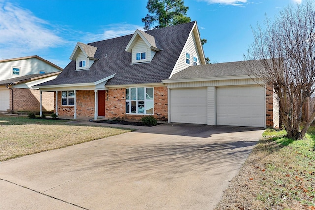 view of front of home with a front yard and a garage