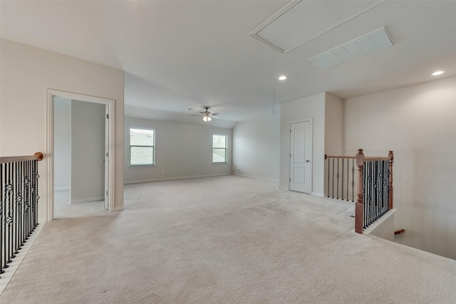 carpeted spare room with ceiling fan