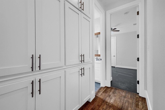 hallway with dark wood-type flooring