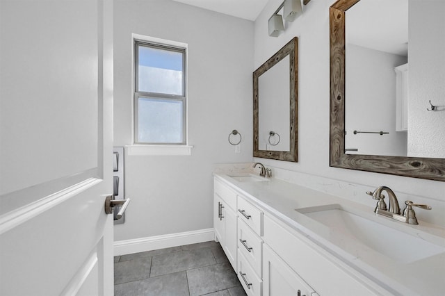 bathroom with tile patterned flooring and vanity