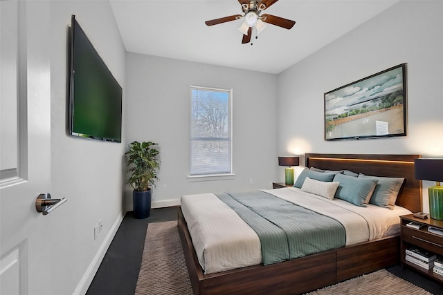 bedroom with baseboards and a ceiling fan