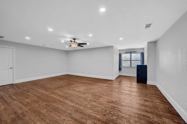 unfurnished living room with ceiling fan, baseboards, wood finished floors, and recessed lighting