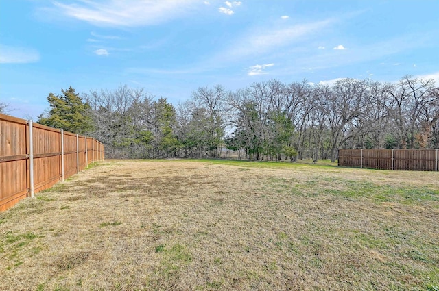 view of yard featuring a fenced backyard