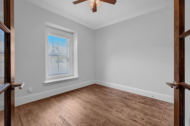 empty room featuring ceiling fan, ornamental molding, and hardwood / wood-style floors