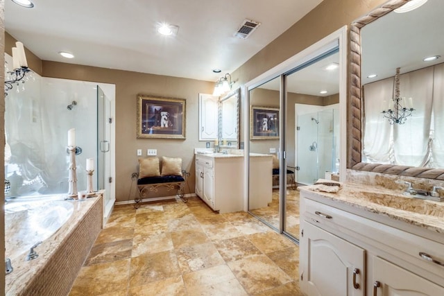 bathroom featuring independent shower and bath, vanity, and a chandelier