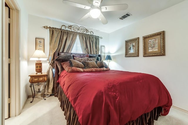 bedroom featuring ceiling fan and light colored carpet