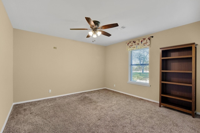 carpeted empty room with ceiling fan