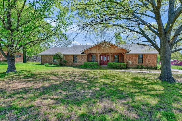 ranch-style home with a front lawn