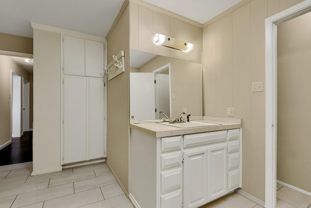 bathroom with tile patterned flooring and vanity