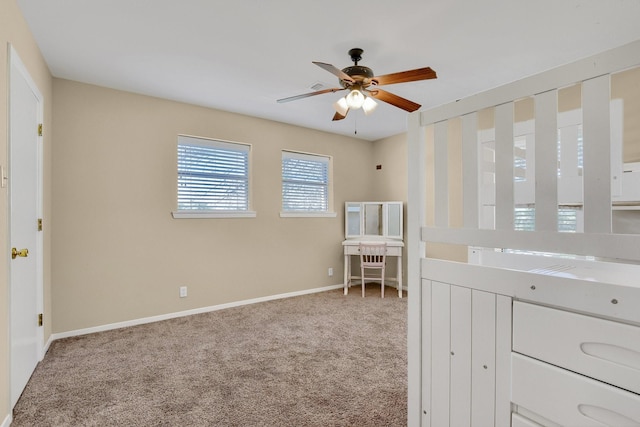 unfurnished bedroom with ceiling fan and carpet flooring